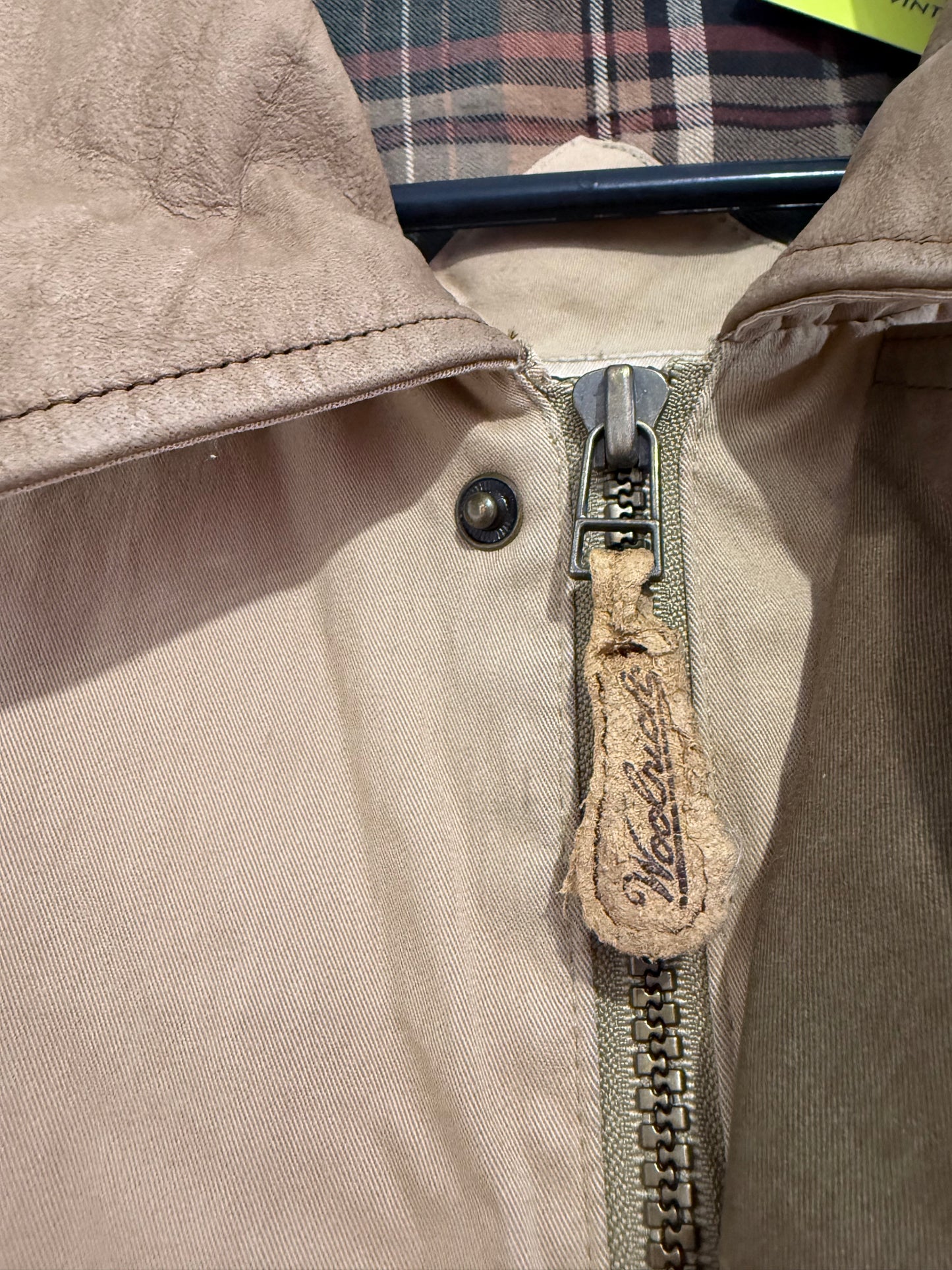 Vintage 90s Woolrich coat in beige. Plaid lined, leather collar. Size large.
