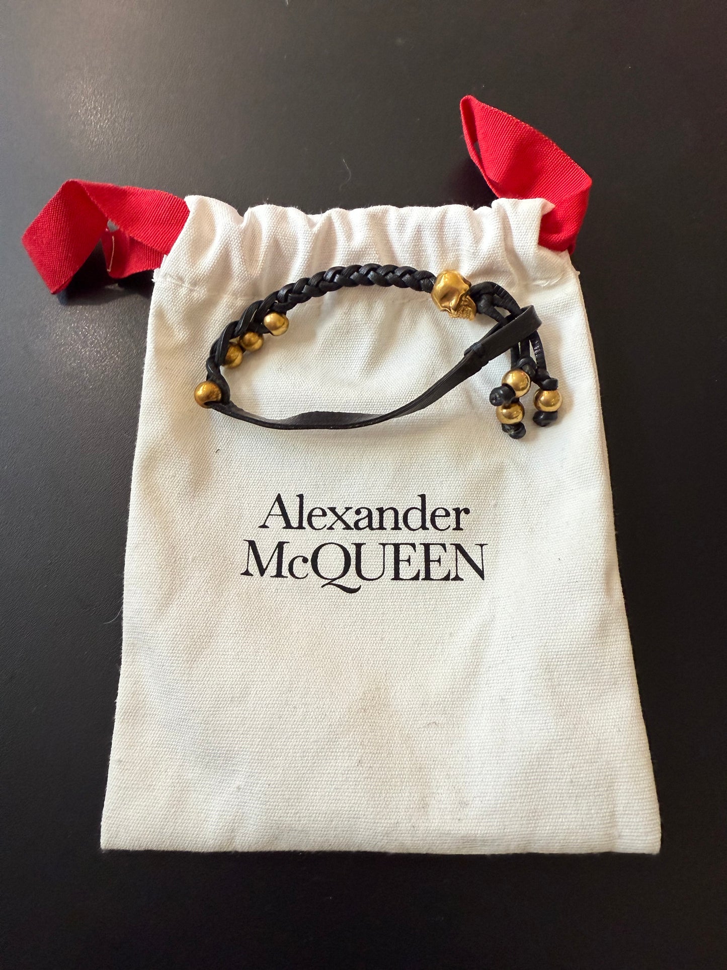 ALEXANDER MCQUEEN BLACK Leather and Swarovski crystal skull bracelet Gold with dust bag.