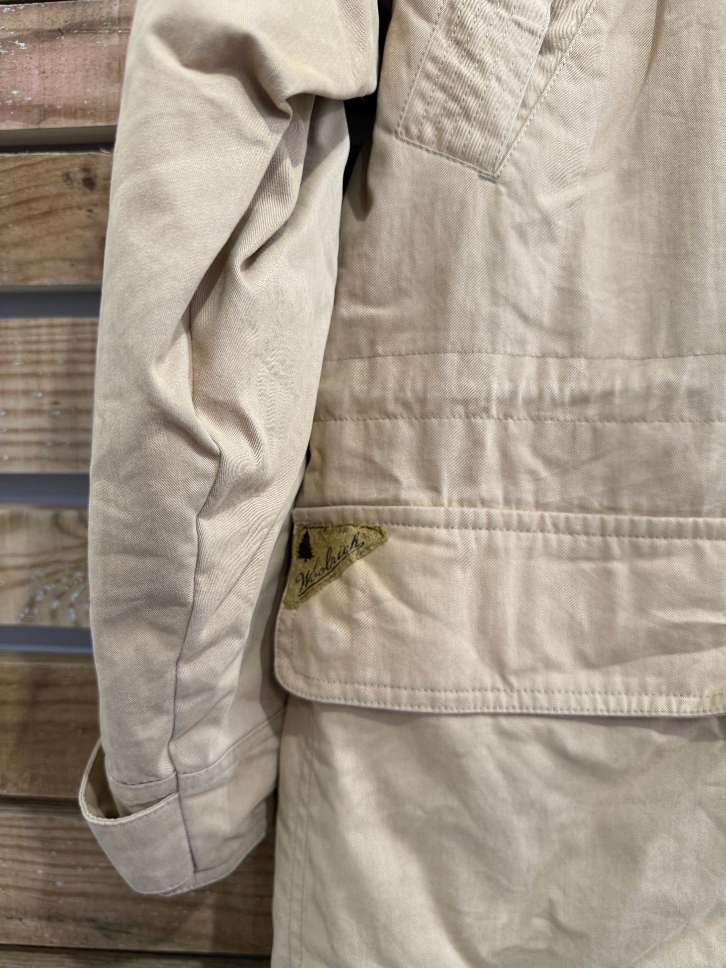 Vintage 90s Woolrich coat in beige. Plaid lined, leather collar. Size large.