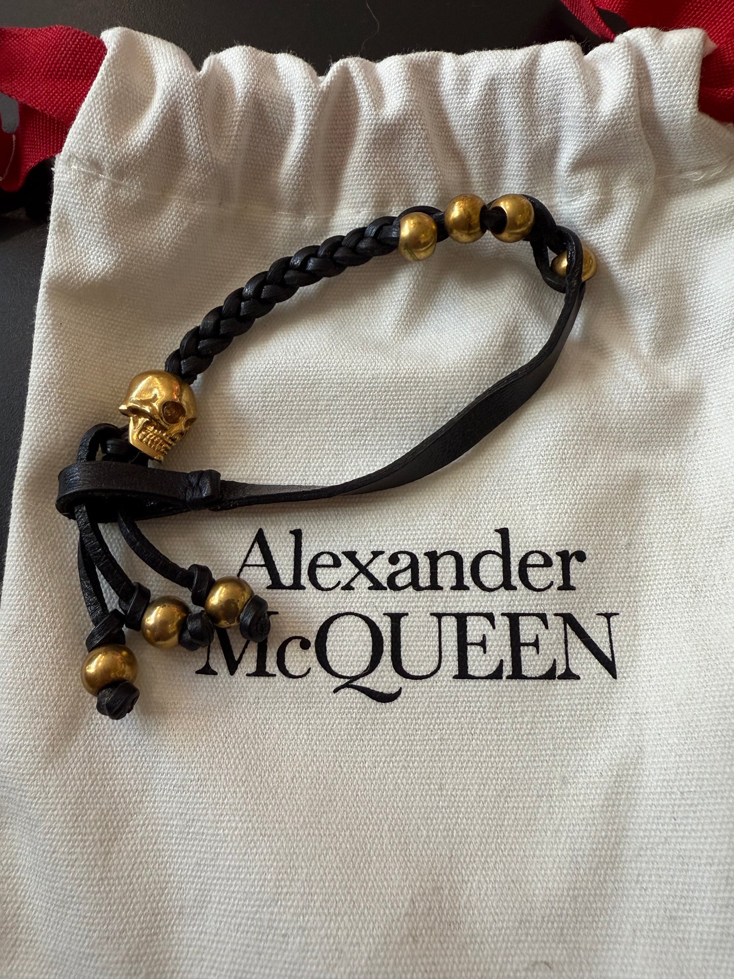 ALEXANDER MCQUEEN BLACK Leather and Swarovski crystal skull bracelet Gold with dust bag.
