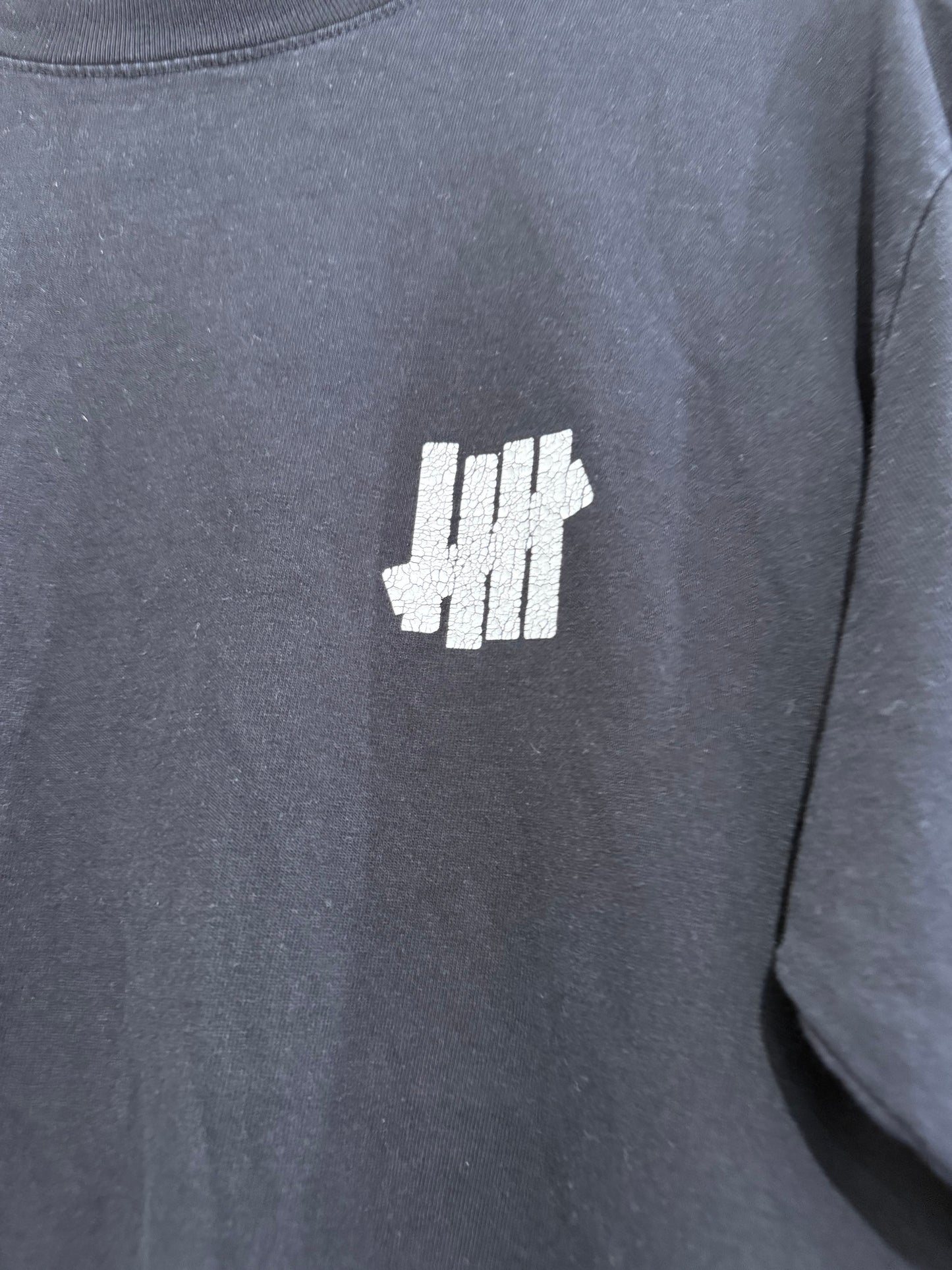 Undefeated printed black Sweater/ Sweatshirt. Size Medium.