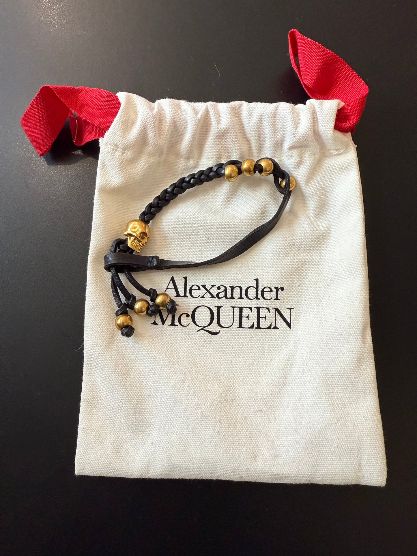 ALEXANDER MCQUEEN BLACK Leather and Swarovski crystal skull bracelet Gold with dust bag.