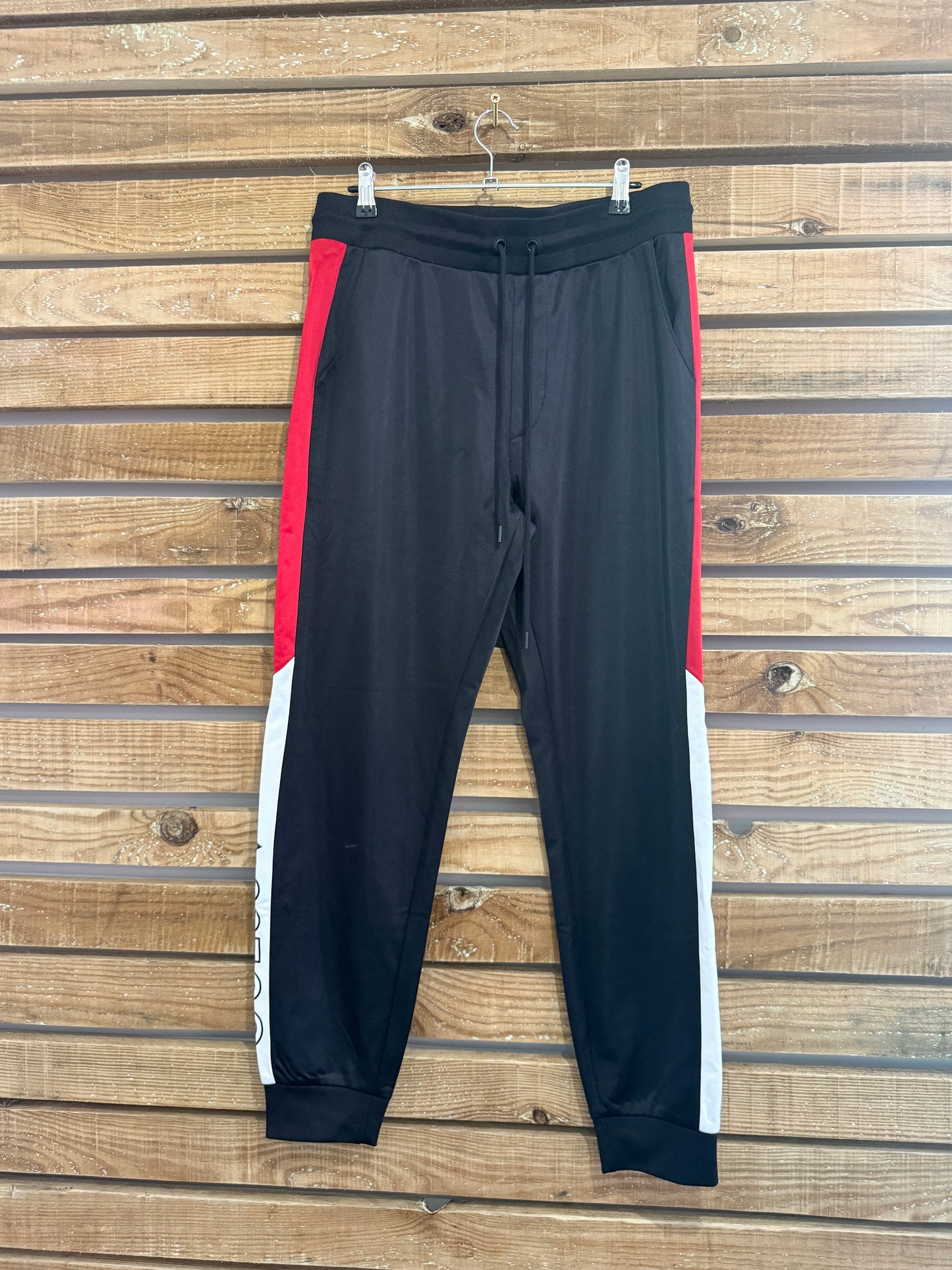 Guess spell-out Joggers/ Track pants. Black. Medium. 33” waist.