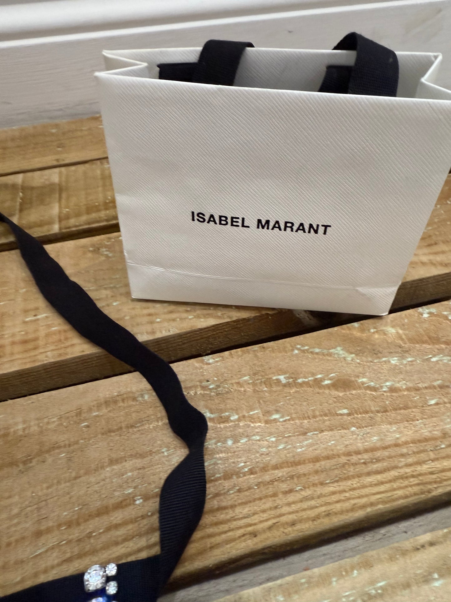 Isabel Marant crystal-embellished fringe choker necklace with bag.