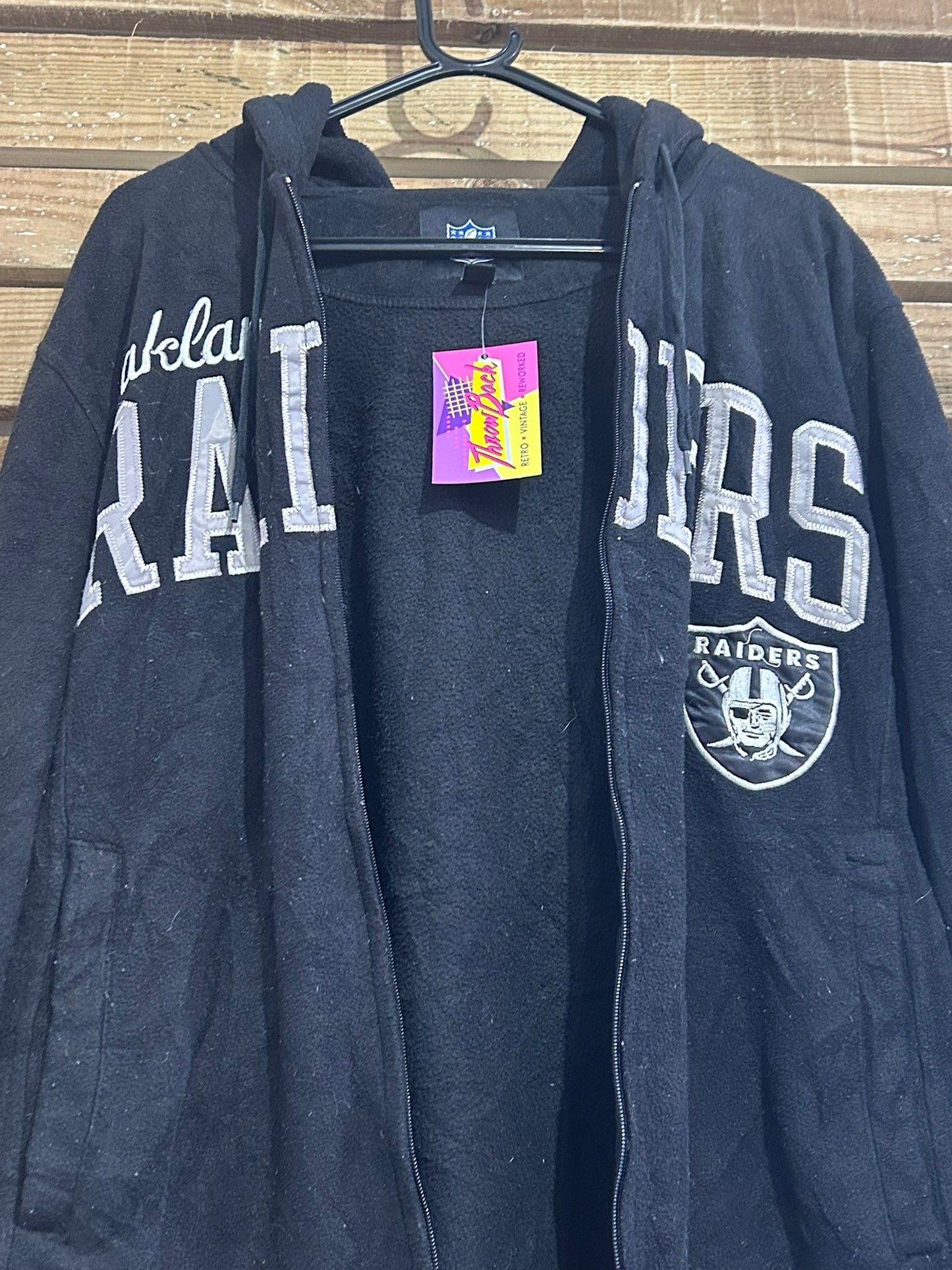 Vintage Y2K NFL Raiders spell-out zip up fleece jacket. Black. Size Medium.