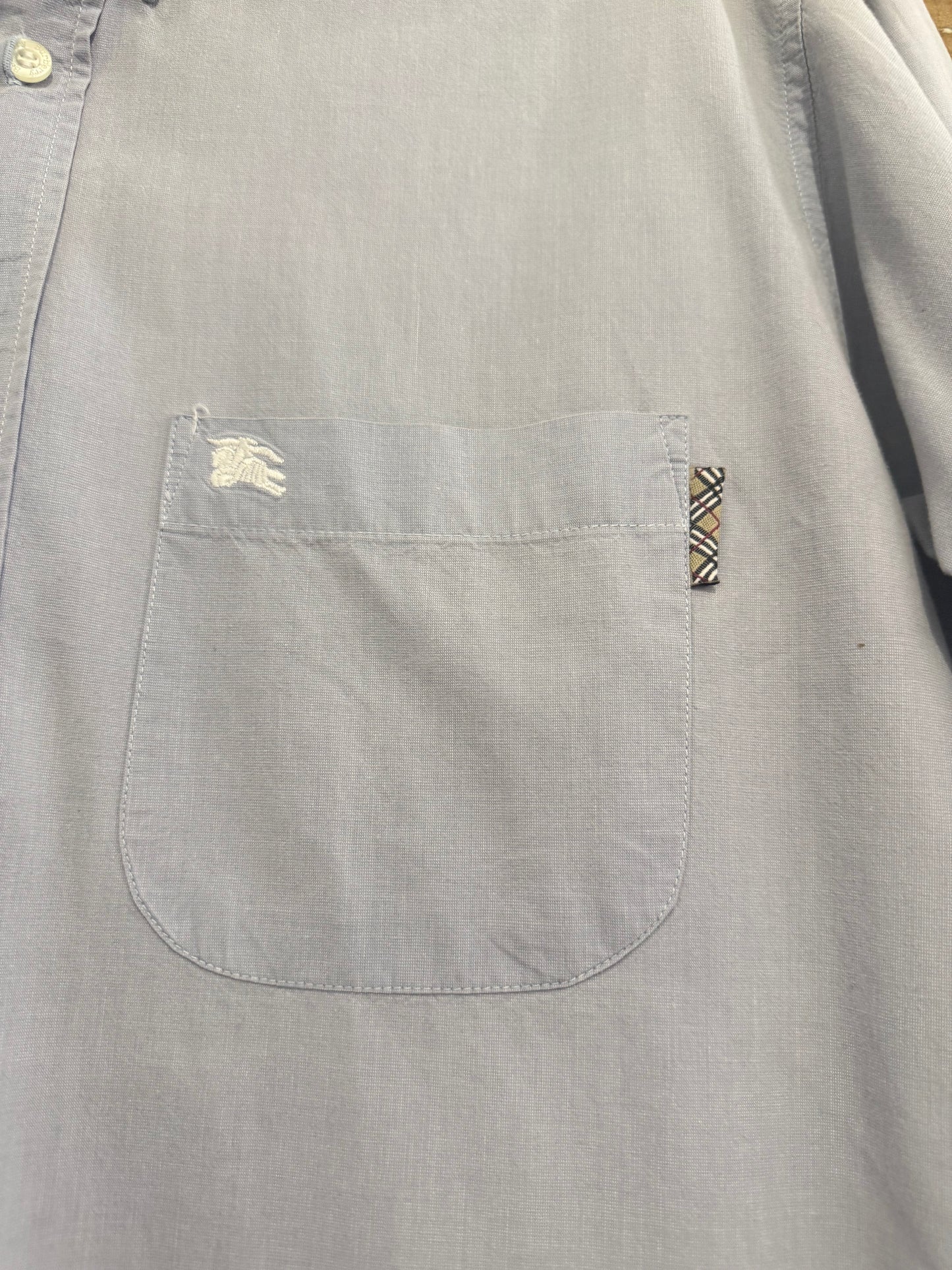 Vintage 90s Burberry blue cotton button up short sleeve shirt. Size Large. 44” chest. Nova check.