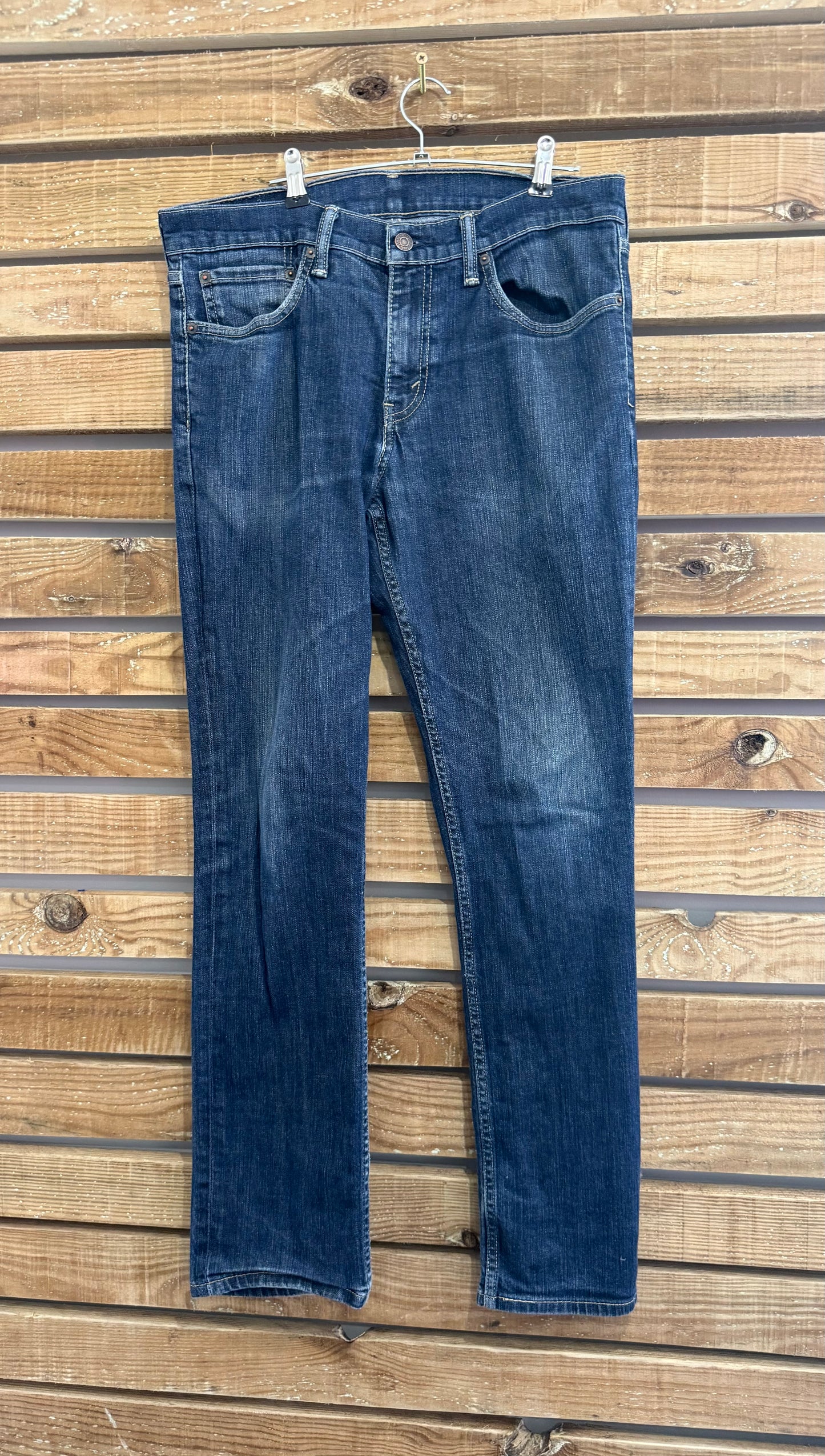 Vintage 90s Levi’s Dark Blue distressed jeans. Waist 32” leg 30”