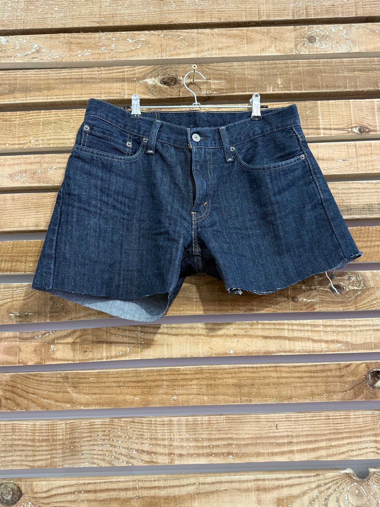 Vintage Y2K Levi’s denim dark wash blue shorts. 32” waist. Size 12.