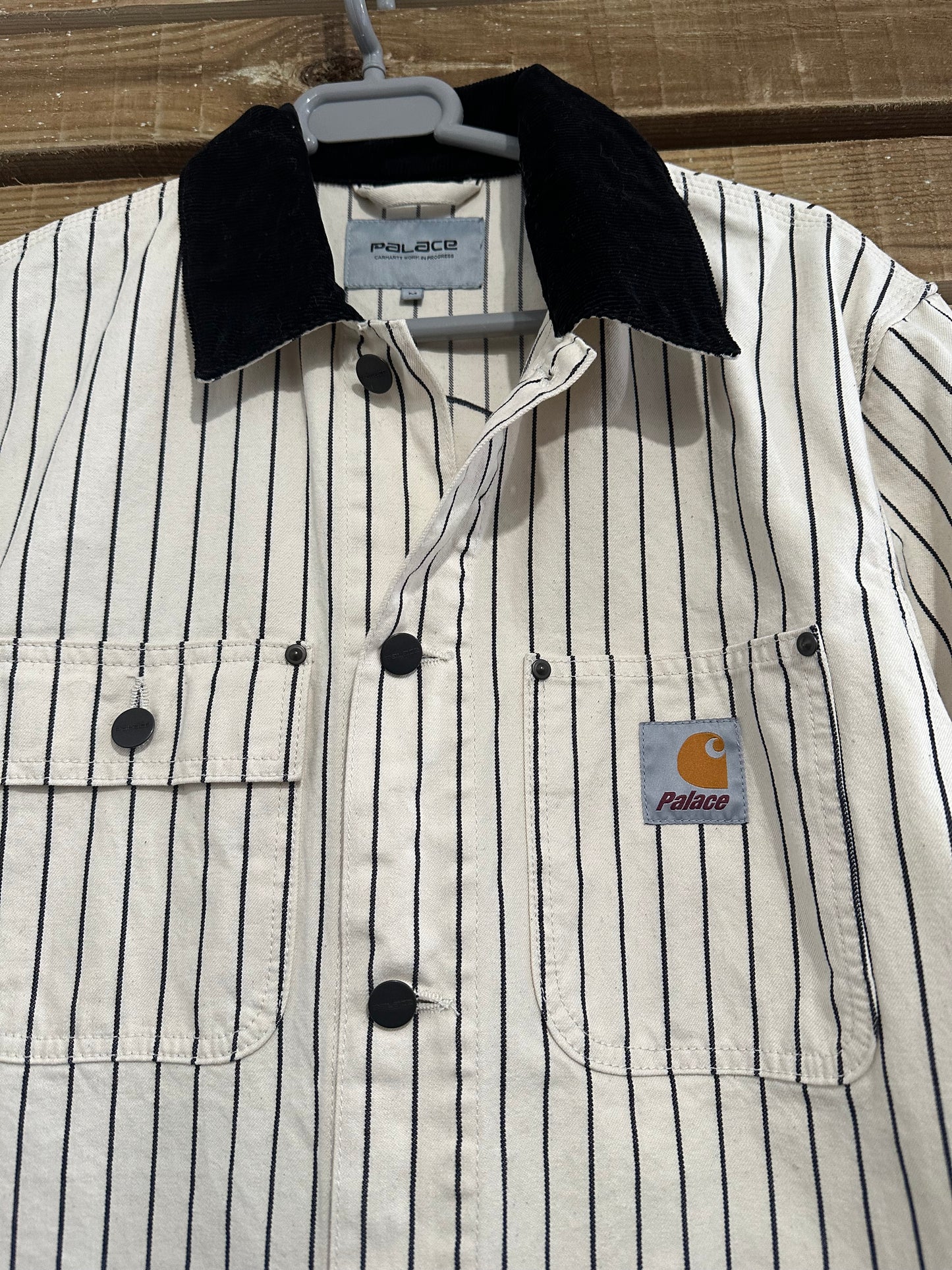 Brand new without tag Carhartt WIP x Palace Michigan Coat. “hickory wax/ Black” size medium.
