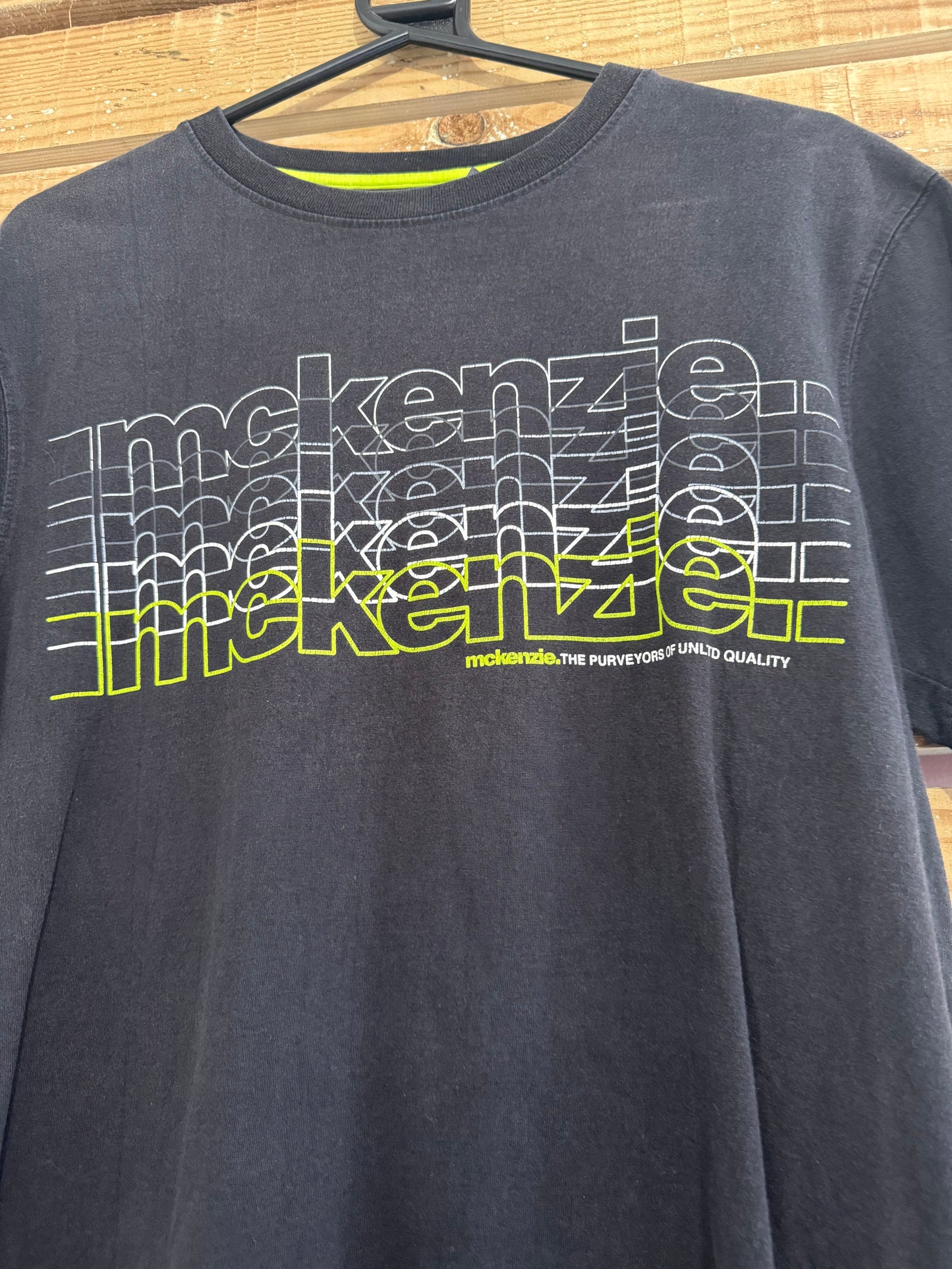 Vintage Y2K McKenzie print motif T-shirt. Black. Size Medium.