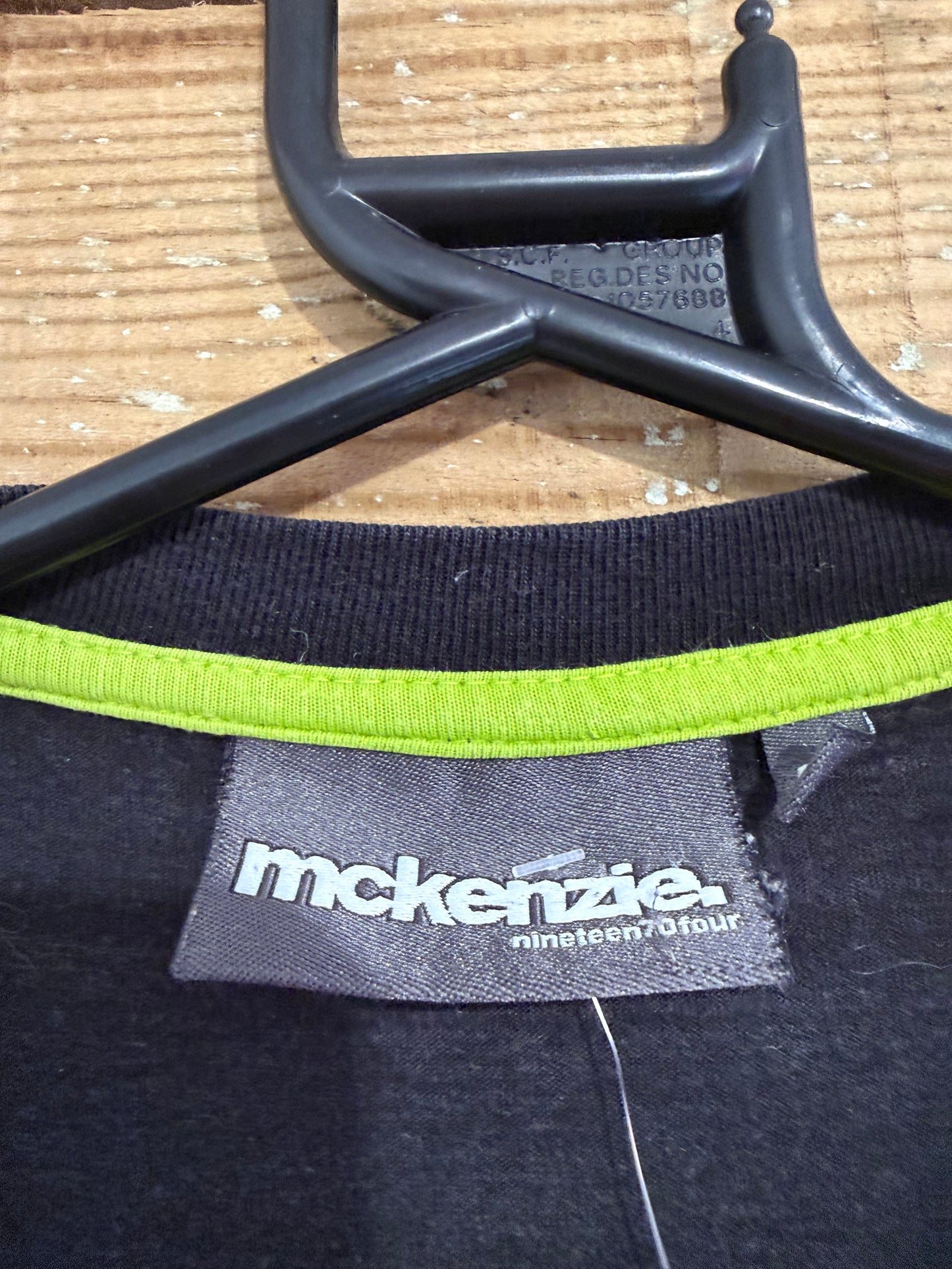 Vintage Y2K McKenzie print motif T-shirt. Black. Size Medium.