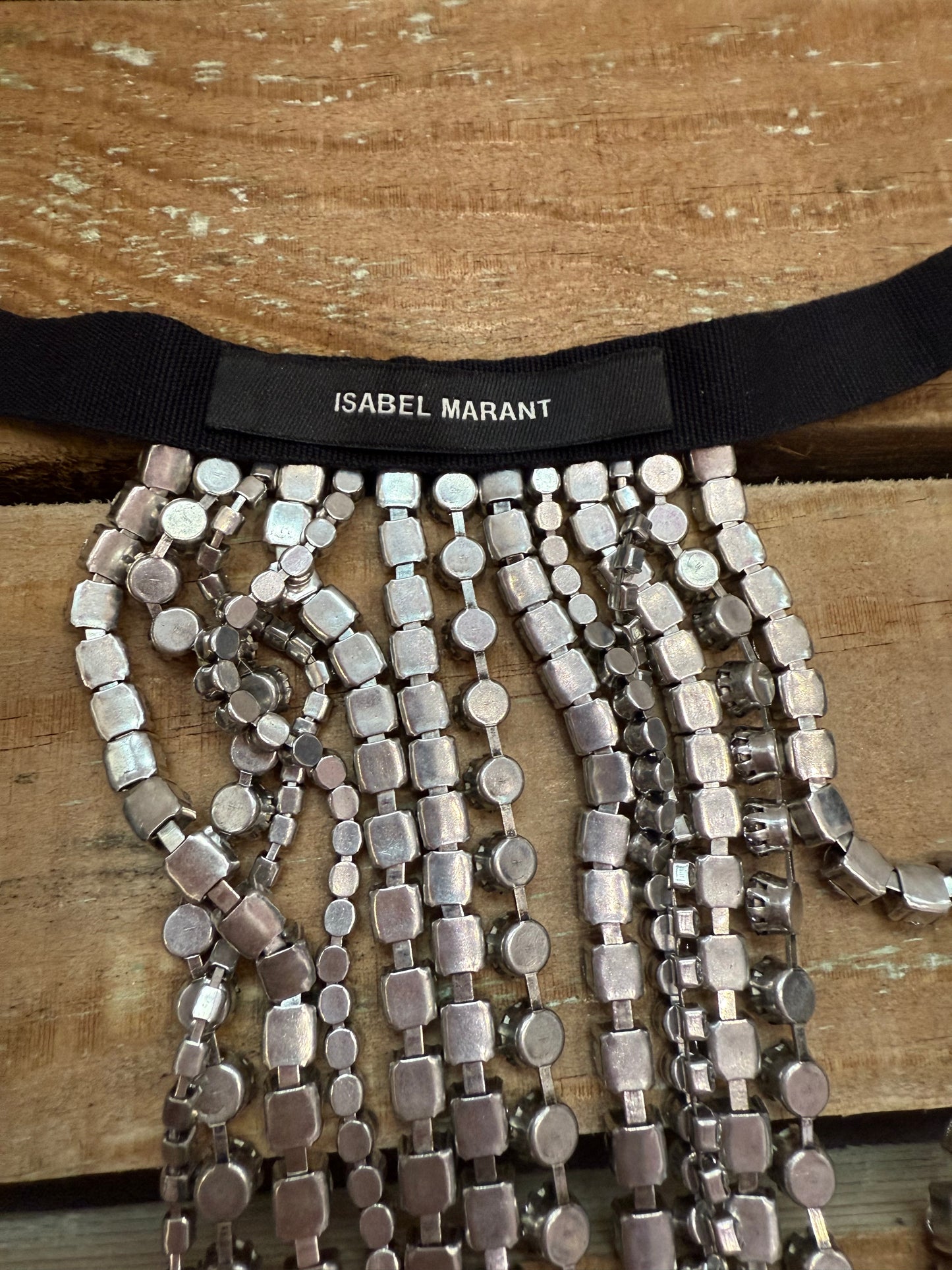 Isabel Marant crystal-embellished fringe choker necklace with bag.